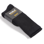 Black Noble alpaca boot socks folded in a Noble paper band