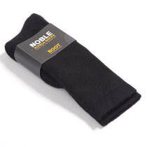 Black Noble alpaca boot socks folded in a Noble paper band