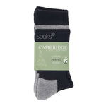 A packaged pair of navy and grey merino wool crew socks in a printed luxury merino socks band.