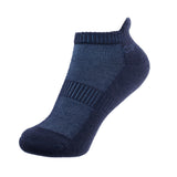 A navy merino wool trainer sock with ribbed arch support panel, shown on a white background.