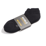 Noble alpaca no-show socks shown low-cut inside a trainer, hidden below the ankle.